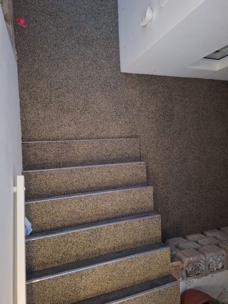 concrete-structure-stoney-carpet-flooring-installation-in-modern-residential-interior